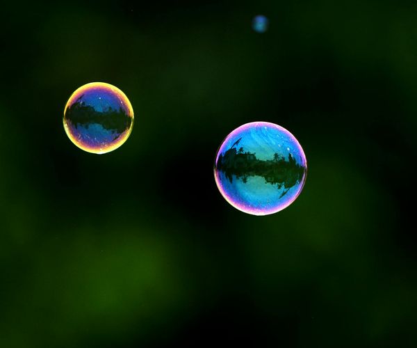 Abstract visualization of lungs breathing in clean, cyan-colored air.